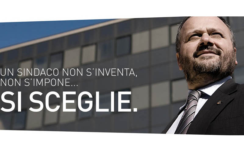 Giovanni-Gaspari-con-uno-slogan-per-le-elezioni-2011